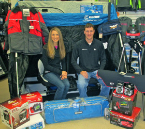(photo by Steve Weisman) Ice fishing gear is taking over at Kabele’s Trading Post. Owners Tanya and Thane Johnson sit in the middle of just a sampling of the ice fishing products people will see at the third annual “Shop with the Pros” day on Saturday, November 15.