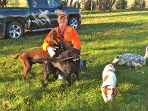 Joe Cain gets his dogs ready for the hunt. Notice how labs always have to be retrieving something, in this case a stick!
