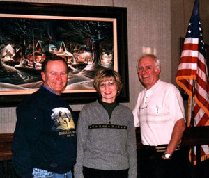 (photo by Julie Ranum): The author, his wife Darial and Terry Redlin pose for a picture during a 2004 interview.