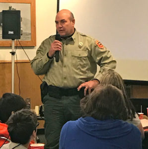 (photo by Steve Weisman) Greg Harson, Law Enforcement Supervisor for conservation officers in District 1, visits with members of the IGLFC at the annual fall meeting. 