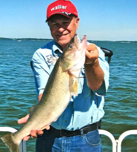 (photo by Mark DeVore) The author with an over the slot walleye taken on Big Spirit Lake in June.
