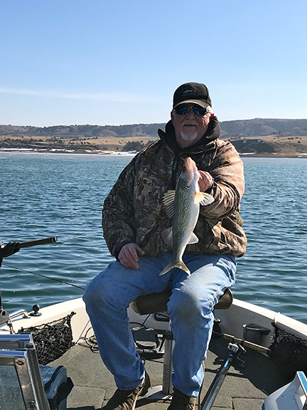 Dave Hennings with a nice 17-inch walleye taken on a jig and minnow.